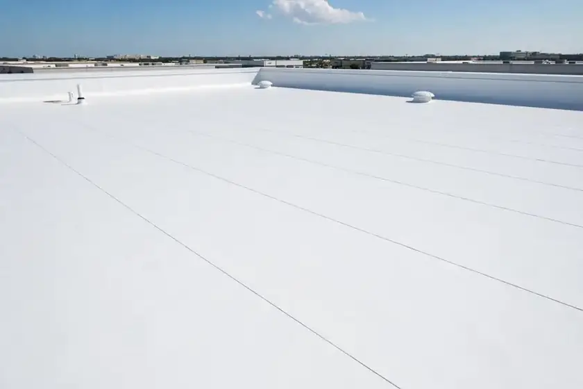 Flat roof with new white TPO membrane after repair