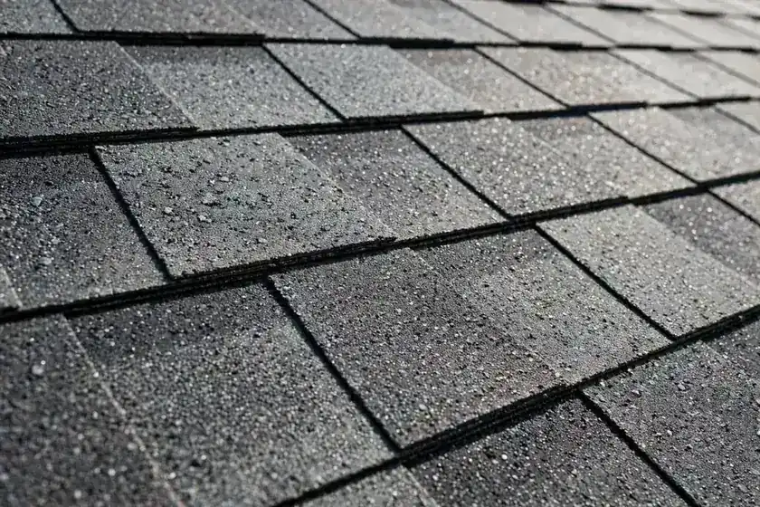 Roof with new shingles after storm damage repair