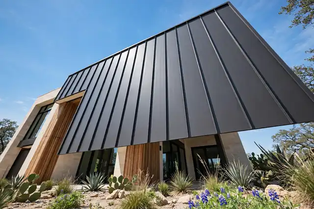 New dark standing-seam metal roof on a modern home